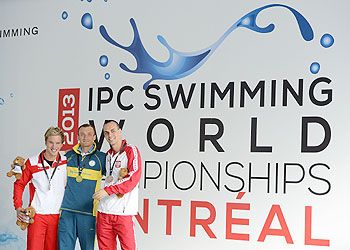 Medal winners for the Men's 100m Breaststroke SB8 final (left to right) Andreas Onea of Austria (Silver), Andriy Kalyna of Ukraine (Gold) and Krysztof Paterka (Bronze) pose with their medals during IPC Swimming World Championships at Parc Jean Drapeau in Montreal, Quebec, Canada, on Wednesday
