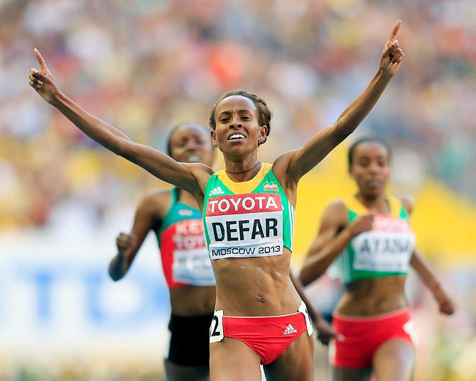 Meseret Defar of Ethiopia crosses the line to win gold in the women's 5000 metres