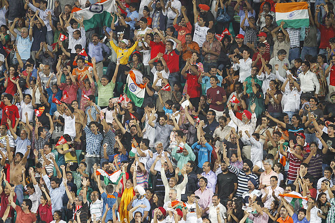 India's hockey fans cheer their team during the 2010 Commonwealth Games