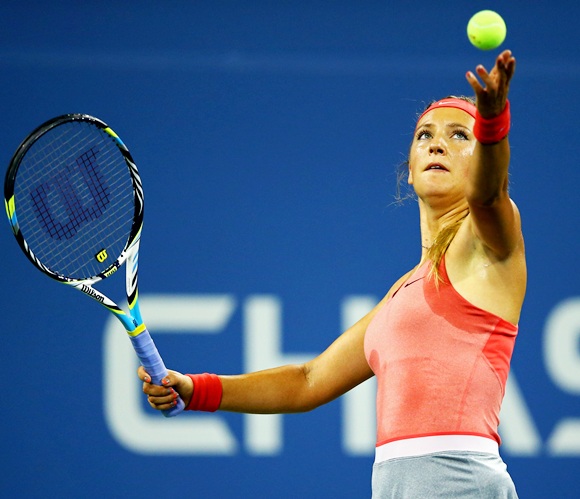 Victoria Azarenka of Belarus tosses the ball in the air to serve