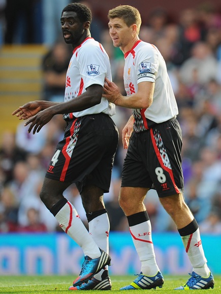 Liverpool captain Steven Gerrard (right) gives Kolo Toure some advice