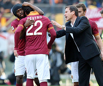 AS Roma's Mattia Destro #22 celebrates with Gervinho (left) and head coach Rudi Garcia after scoring the team's second goal against Fiorentina during their Serie A match at Stadio Olimpico on in Rome on Sunday