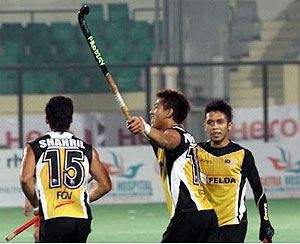 Malaysian players celebrate a goal on Monday