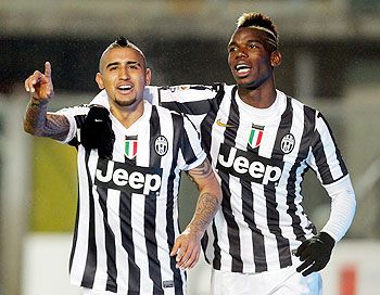 Arturo Vidal (left) and Paul Pogba of Juventus celebrate a goal against Atalanta BC at Stadio Atleti Azzurri d'Italia in Bergamo, Italy on Sunday