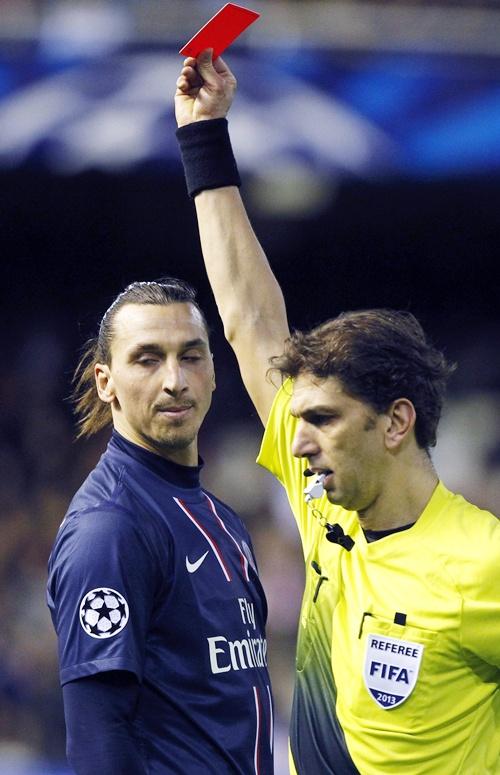 Paris Saint Germain's Zlatan Ibrahimovic (left) reacts as he is shown a red card