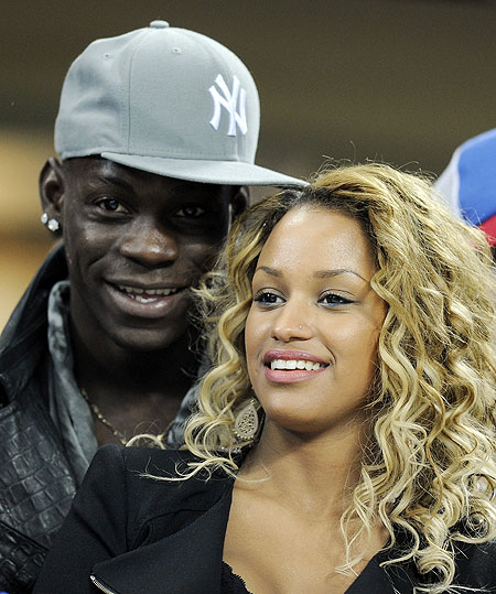 Mario Balotelli and girlfriend Fanny Neguesha attend the Champions League match between AC Milan and Barcelona on Wednesday