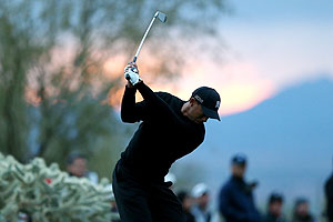 Tiger Woods hits his tee shot on the 16th hole during the first round of the World Golf Championships - Accenture Match Play at the Golf Club at Dove Mountain on in Marana, Arizona on Thursday