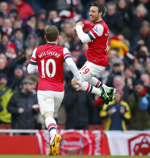 Santi Cazorla (right) of Arsenal celebrates