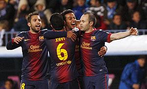 Barcelona players celebrate scoring against Malaga