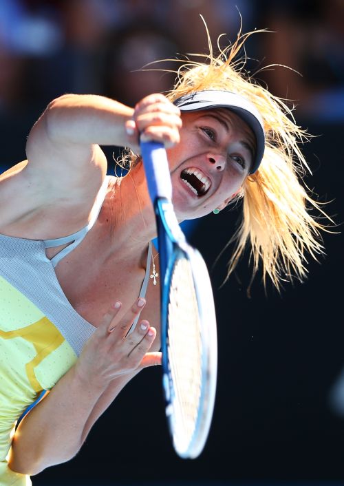 Maria Sharapova of Russia serves in her fourth round match against Kirsten Flipkens of Belgium during day seven of the 2013 Australian Open