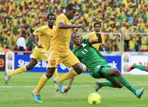 Zambia's Stopilla Sunzu (right) challenges Ethiopia's Adane Girma