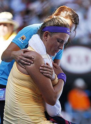 Victoria Azarenka of Belarus receives medical treatment during a break in her women's singles semi-final match against Sloane Stephens on Thursday