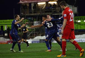 Reece Wabara of Oldham Athletic celebrates scoring his team's third goal during the FA Cup match against Liverpool at Boundary Park on Sunday