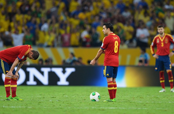  Xavi Hernandez of Spain prepares to kick off with teammate Fernando Torres (left) after conceding their third goal