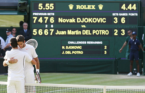 Novak Djokovic is congratulated by Juan Martin del Potro