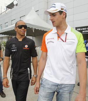 Force India's Adrian Sutil (right)