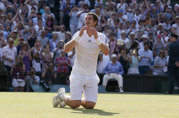 Andy Murray of Britain reacts after defeating Novak Djokovic of Serbia in their men's singles final tennis match at the Wimbledon Tennis Championships