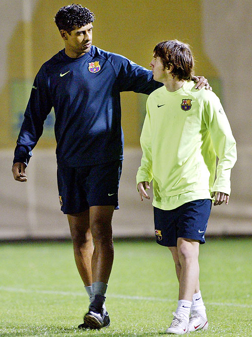 Former Barcelona coach Frank Rijkaar with Lionel Messi in November 2005