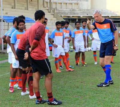 India football coach Wim Koevermans speaks to the players during a training session