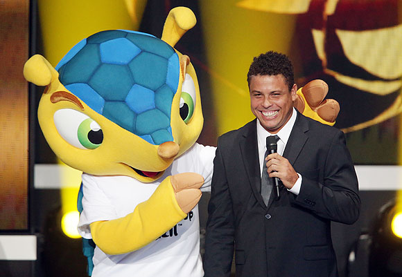 Mascot Fuleco of FIFA World Cup 2014 in Brazil poses with Ronaldo