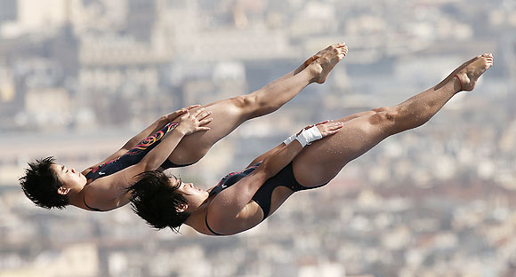 China's Liu Huixia and Chen Ruolin perform a dive at the women's synchronised 10m platform preliminary during the World Swimming Championships at the Montjuic municipal pool in Barcelona on Monday