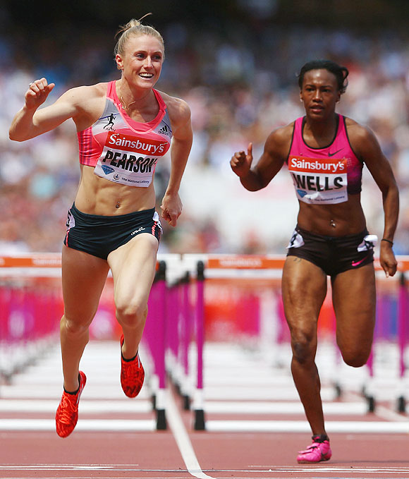 Sally Pearson of Australia crosses the line to win the Women's 100m Hurdles during day two of the Sainsbury's Anniversary Games - IAAF Diamond League 2013 at The Queen Elizabeth Olympic Park in London on Saturday
