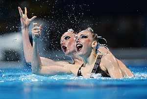 Russia's Svetlana Kolesnichenko and Svetlana Romashina perform in the synchronised swimming duet free final during the World Swimming Championships at the Sant Jordi arena in Barcelona