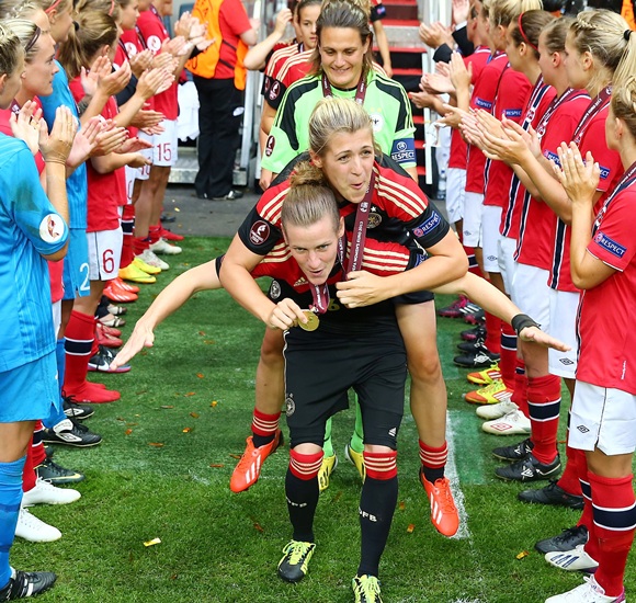 Simone Laudehr and Luisa Wensing of Germany celebrate after the UEFA Women's EURO 2013 final