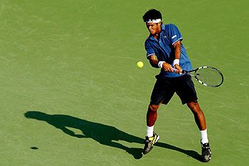 Somdev Devvarman of India returns a shot against defending champion Alexandr Dolgopolov of Ukraine during the Citi Open at the William H.G. FitzGerald Tennis Center in Washington, DC. on Tuesday