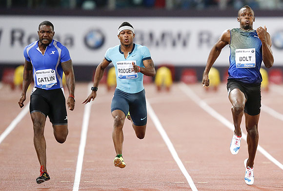 Justin Gatlin of the U.S. (left) pips Usain Bolt of Jamaica (right) to win the men's 100m event at the Golden Gala IAAF Diamond League at the Olympic stadium in Rome on Thursday