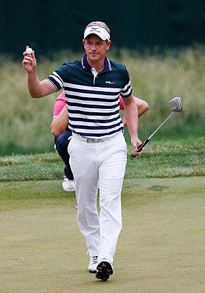 Luke Donald of England waves after making a putt for birdie on the 13th hole during Round One of the 113th U.S. Open at Merion Golf Club in Ardmore, Pennsylvania, on Thursday