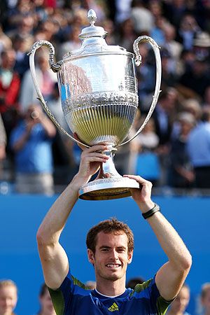 Andy Murray lifts the trophy after winning the AEGON Championships at Queens Club on Sunday