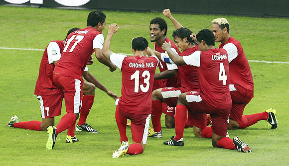 Tahiti's players break into a jig as they celebrate a goal against Nigeria during their Confederations Cup match at the Estadio Mineirao in Belo Horizonte on Monday