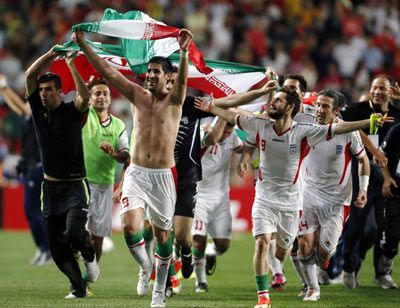 Iran's football players celebrate victory