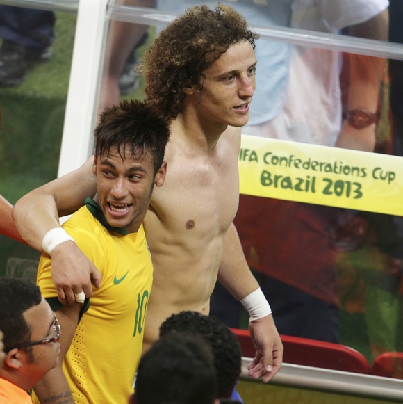 Brazil's David Luiz (right) and his teammate Neymar walk together after winning
