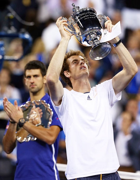 Andy Murray of Great Britain lifts the US Open championship trophy in 2012