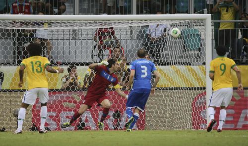 Brazil's Neymar (not in picture) scores a goal on a free kick during their Confederations Cup Group A soccer match against Italy at the Arena Fonte Nova