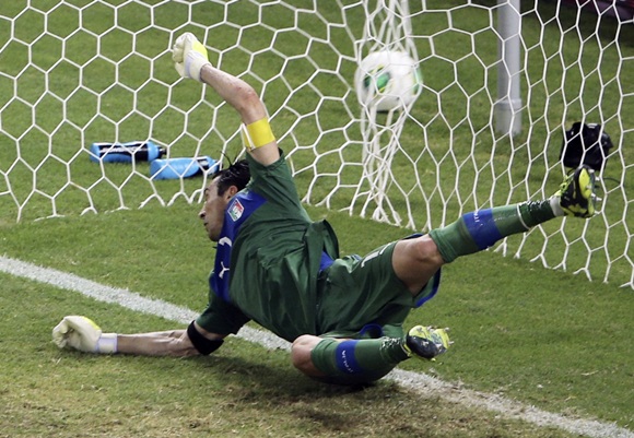 Italy's goalkeeper Gianluigi Buffon dives