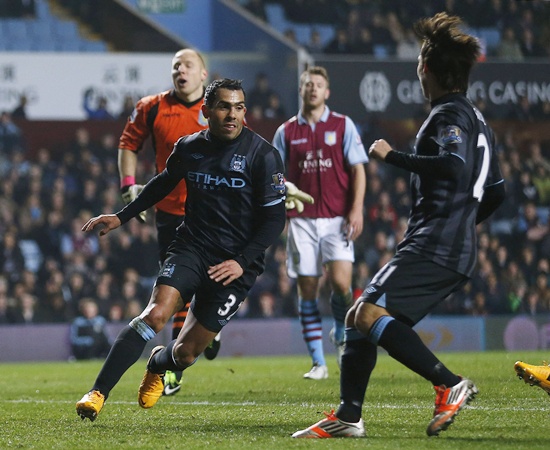 Manchester City's Carlos Tevez (left) celebrates his goal Aston Villa with teammate David Silva