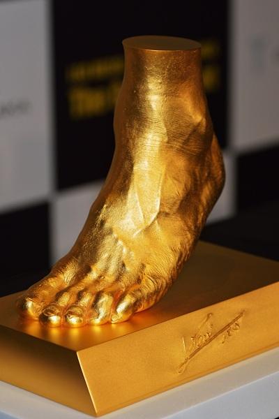 A golden statue of the left foot of Lionel Messi is displayed at the launching at Harajuku Quest Hall  in Tokyo, Japan.