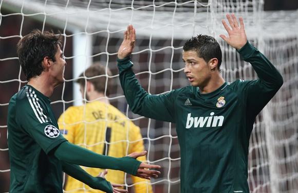 Cristiano Ronaldo of Real Madrid (right) reacts after scoring