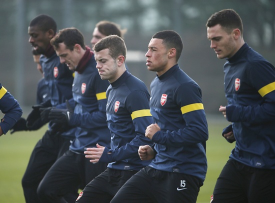 Arsenal's Jack Wilshire (centre) reacts during a team training session