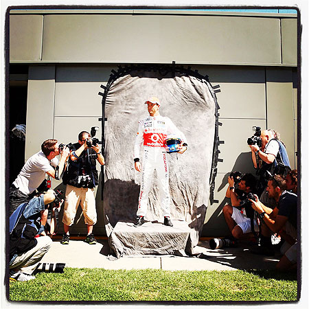 Jenson Button of McLaren poses for photographers at the drivers official portrait session during previews to the Australian Formula One Grand Prix at the Albert Park Circuit on Thursday