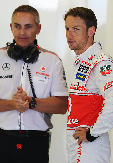McLaren's Jenson Button talks with his Team Principal Martin Whitmarsh as he prepares for  practice for the Australian Formula One Grand Prix at the Albert Park Circuit on Friday