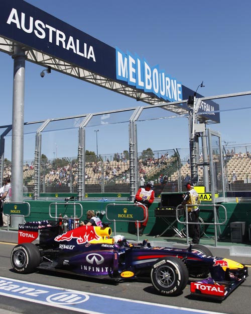 Red Bull Formula One driver Sebastian Vettel of Germany arrives back in the pits