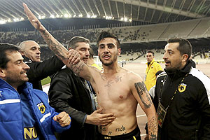 AEK Athens' Giorgos Katidis (centre) celebrates a goal during a Super League football match against Veria at the Olympic stadium in Athens on Saturday. Katidis was at the centre of a fascist row after celebrating his winning goal in a 2-1 Super League victory over lowly Veria by appearing to give a Nazi salute to supporters