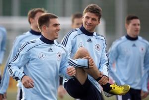 Germany's Philipp Lahm (left) and Thomas Mueller attend a training session