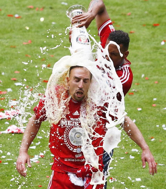Bayern Munich's Jerome Boateng pours beer over teammate Franck Ribery