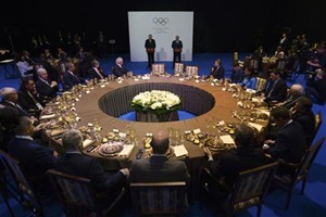 Russia's President Vladimir Putin (R) and International Olympic Committee (IOC) President Jacques Rogge attend the International Olympic Committee's (IOC) Executive Board meeting, which is part of the annual SportAccord convention, in St. Petersburg