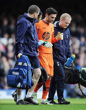 Hugo Lloris of Tottenham Hotspur leaves the field through injury during the Barclays Premier League match against Everton at Goodison Park in Liverpool, on Sunday